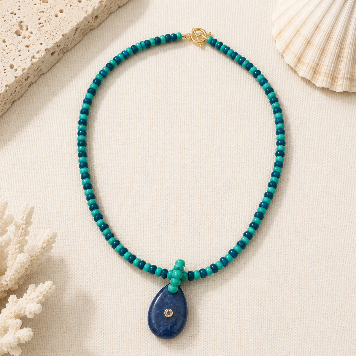 Multi green beaded necklace with navy pendant