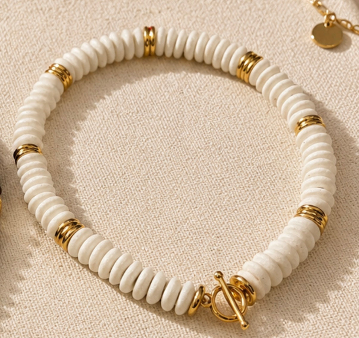 White and gold collar