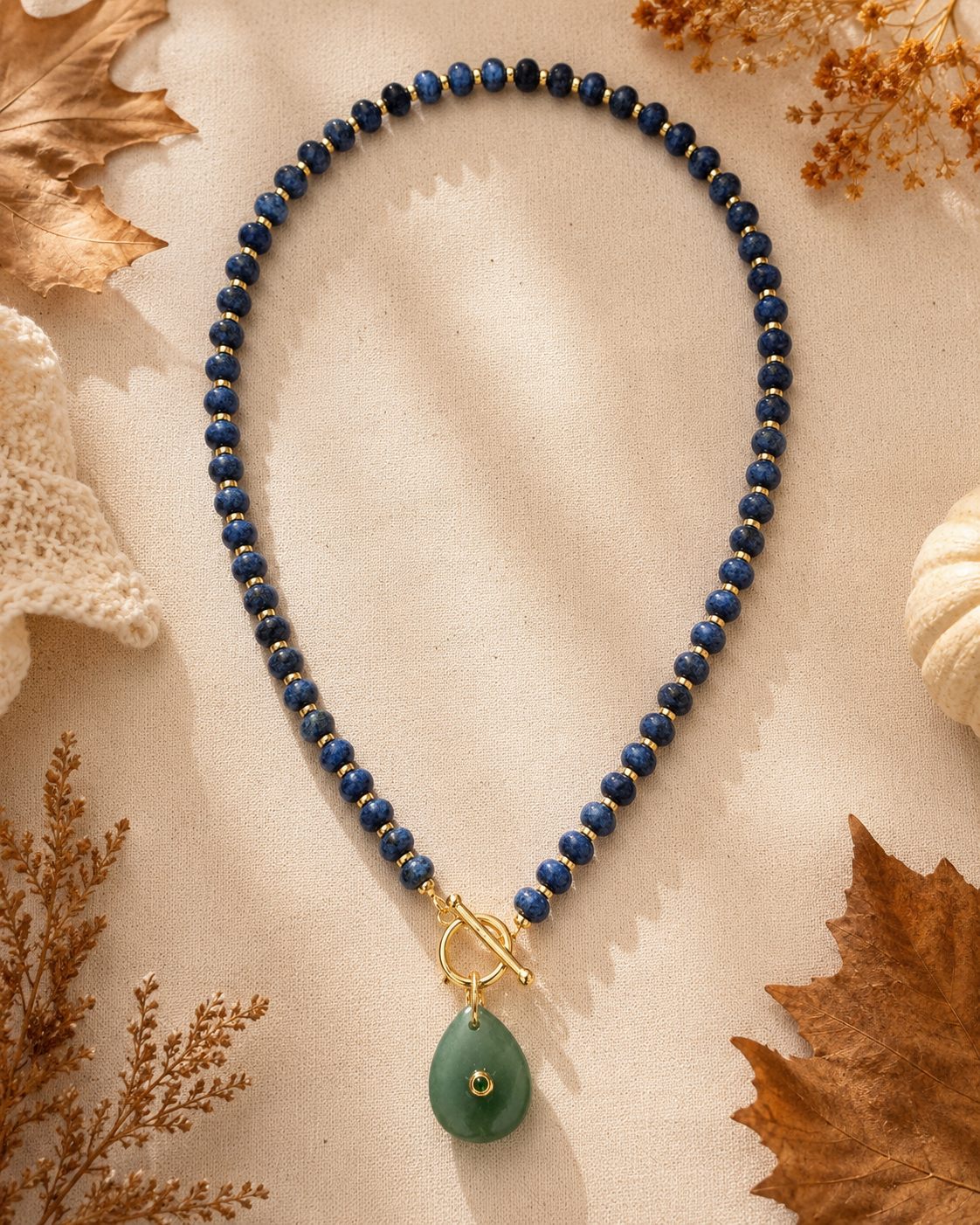 Navy stone with green pendant